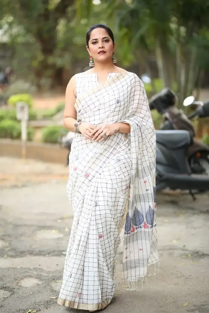 Anasuya Bharadwaj in White Saree at Razakar Movie Launch